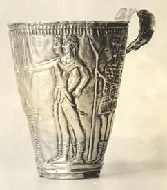 Bronze Age Minoan cup, ca.1600 B.C.E. The drawing depicts a treaty ceremony involving soldiers and farmers. The soldiers are holding swords and wearing plumed hats, while the two farmers off to the right are carrying staffs and wearing bulkier clothing. Courtesy University of Illinois: 